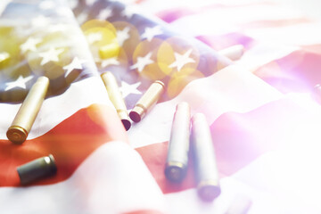 Abstract background with American flag on a gray background. Militaristic background USA and European Union and bullets.