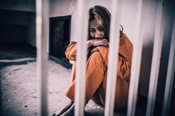 Portrait of women desperate to catch the iron prison,prisoner concept,thailand people,Hope to be...