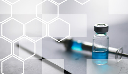 small jars with injection and syringe for injection on a blue background near the chemical formula