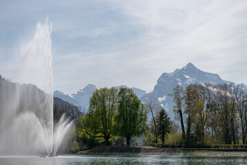 Fototapeta premium Water jet in the lake Walensee in Weesen in Switzerland
