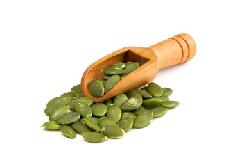 Peeled pumpkin seeds in scoop isolated on a white background. Raw shelled pumpkin seeds