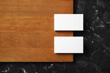 Blank business cards on wooden board background. Mockup for ID. Template for graphic designers...