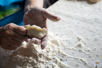  Woman cooking pies at home. Cooking and baking at home.