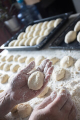  Woman cooking pies at home. Cooking and baking at home.