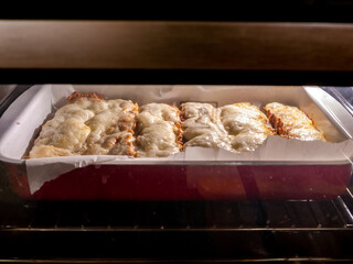 View on sandwiches in the oven while being grilled