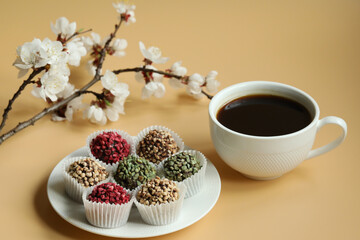 Obraz na płótnie Canvas cup of coffee with chocolate handmade candies