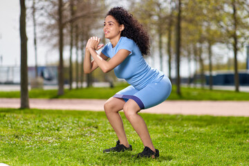 girl in sportswear goes in for sports at the park