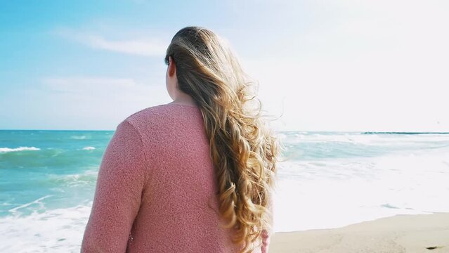 Beautiful curvy woman having fun outdoor on a beautiful day in Los Angeles, California. Body positive and self acceptance representation concepts