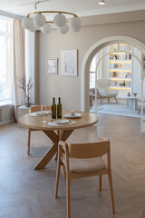 fashionable modern design luxury apartment in light colors. bright day behind huge windows. stylish decoration and no one inside.