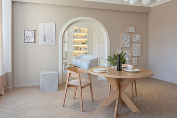 fashionable modern design luxury apartment in light colors. bright day behind huge windows. stylish decoration and no one inside.