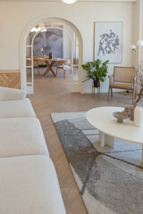 fashionable modern design luxury apartment in light colors. bright day behind huge windows. stylish decoration and no one inside.