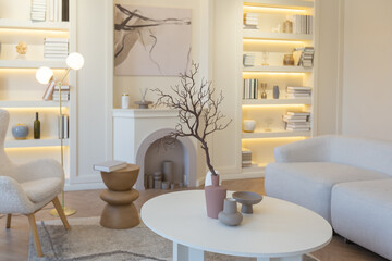 fashionable modern design luxury apartment in light colors. bright day behind huge windows. stylish decoration and no one inside.