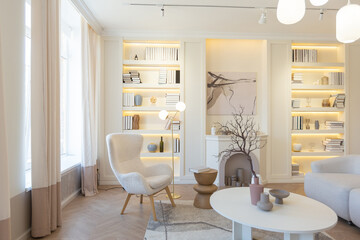 fashionable modern design luxury apartment in light colors. bright day behind huge windows. stylish decoration and no one inside.