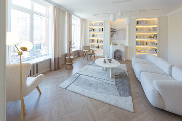 fashionable modern design luxury apartment in light colors. bright day behind huge windows. stylish decoration and no one inside.