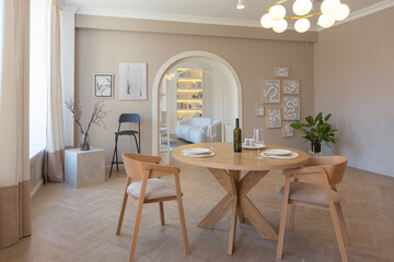 fashionable modern design luxury apartment in light colors. bright day behind huge windows. stylish...