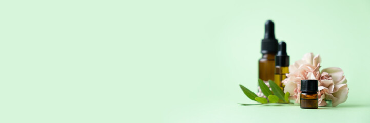 Essential oils , various bottles aromatherapy on a green background. Aromatherapy and perfumes concept