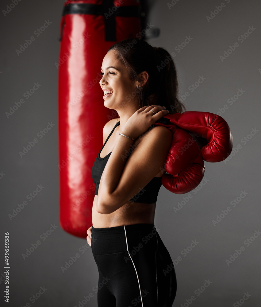 Sticker Those endorphins are flowing. Cropped shot of an attractive young female boxer training in the gym.