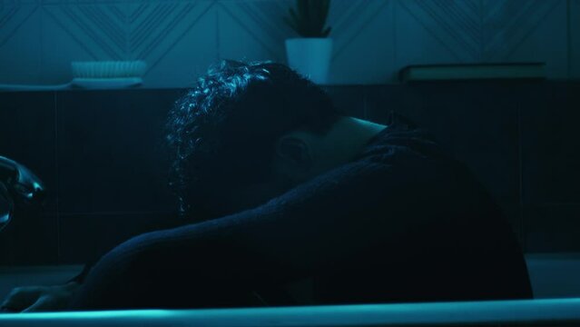 lonely boy in the bathtub with sad atmosphere