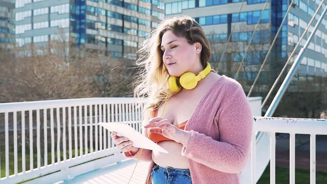 Beautiful curvy woman having fun outdoor on a beautiful day in Los Angeles, California. Body positive and self acceptance representation concepts