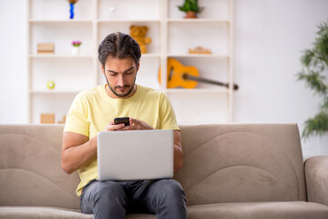 Young male student studying at home