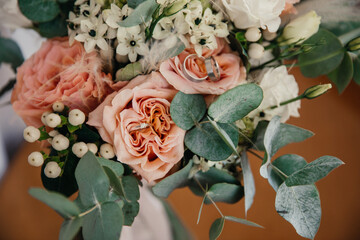 wedding rings in a flower bud in a wedding bouquet