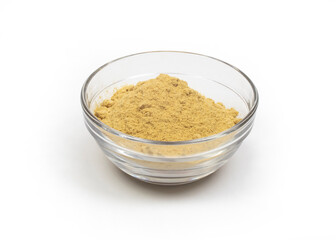 ginger powder in a glass bowl isolated on white background