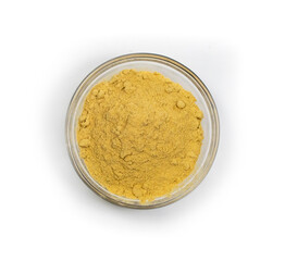ginger powder in a glass bowl isolated on white background (top view)