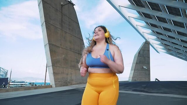 Beautiful curvy woman making sport on a beautiful day in Los Angeles, California. Body positive and self acceptance representation concepts