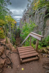Slattdalsskrevan Canyon in Skuleskogen National Park, Sweden. Narrow crevasse in solid rock on a cloudy summer day. Hiking along the High Coast Trail in Sweden. Hohe Kustenleden trail.