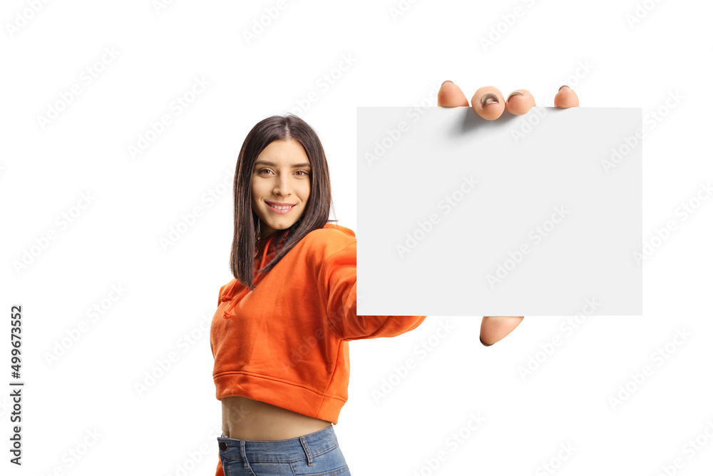 Wall mural young female in an orange sweatshirt showing a blank id card