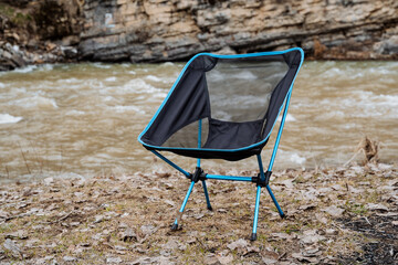 Folding chair easy to relax, camping equipment, compact folding chair on legs, relaxation in nature...