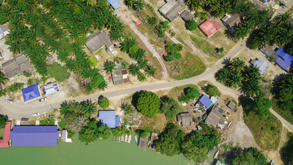 Aerial drone view of rural settlements by the riverside in Sedili Kecil, Johor, Malaysia