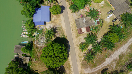 Fototapeta na wymiar Aerial drone view of rural settlements by the riverside in Sedili Kecil, Johor, Malaysia