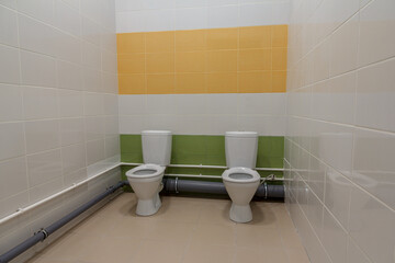 Toilet in the kindergarten. Small toilets for kids in a kindergarten.