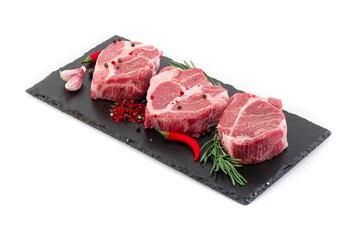 Pieces of meat with marinade on a black board