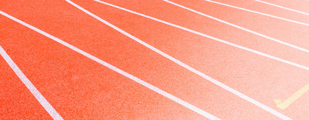 Red runninng race track with border lanes closeup, Treadmill at stadium, Summer sport and fitness concept