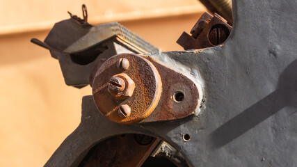 The detail of an old rusty mechanism. Rusty metal construction 