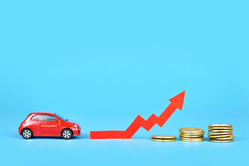 Small car with rising arrow and money coins on blue background