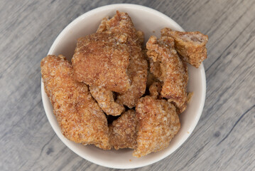 Overhead view of hearty bowl loaded with Mantequitas, crispy and crunch and ready to eat as an appetizer