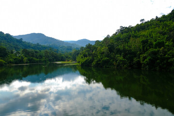 Fototapeta na wymiar Calm view of dam water surrounded with green trees in Kuala Kubu Bharu, Selangor, Malaysia.