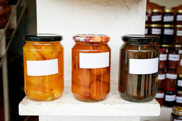 Traditional fruit sweets, in glass jars on the store counter.