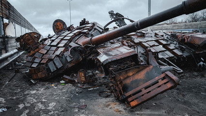 War in Ukraine, Zhytomyr highway, Kyiv region, a destroyed Russian tank with a torn off turret...