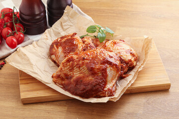 Marinated chicken leg in tomato sauce
