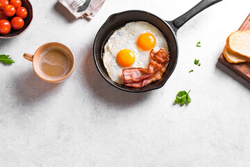 Fried eggs and bacon for breakfast