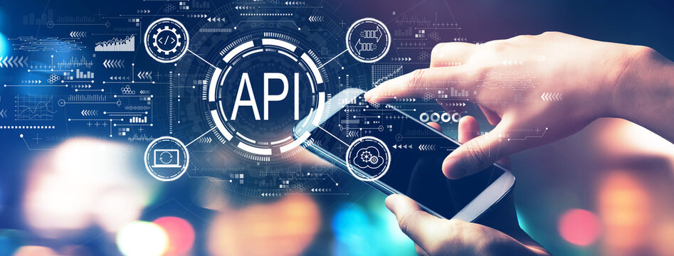 API - application programming interface concept with blurred city lights at night