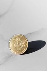 Bitcoin symbol on marble table. BTC golden money 