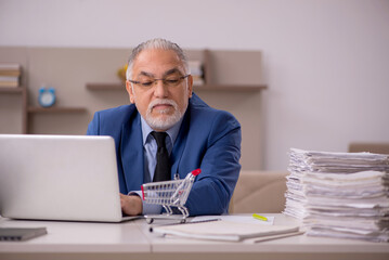 Old male boss working from home during pandemic
