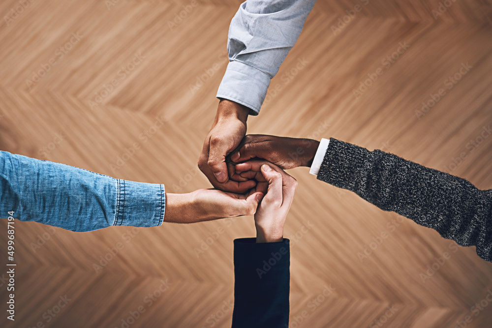 Aufkleber working together towards one goal. high angle shot of a group of unidentifiable businesspeople joini