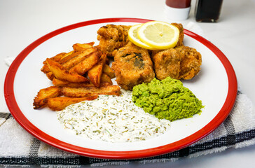 vegan fish and chips with vegan source, tofu and chips