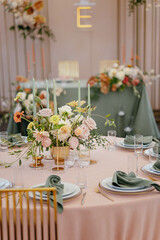 Wedding decor at the restaurant. Pink, gold, many pastel colors. 